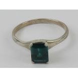 A silver ring having central rectangular cut rich green stone, stamped 925, size S.