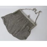 A HM silver chain link evening bag bearing Chester 1915 import hallmark to the pierced floral