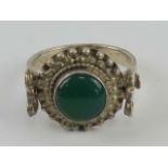 A silver and green onyx ring in the Indo-Asian style, stamped 925, size P.