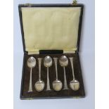 A set of six HM silver Egyptian revival teaspoons in fitted box (slightly a/f),