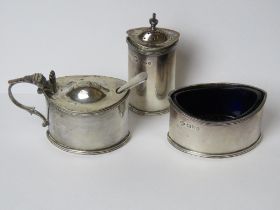 A HM silver cruet set comprising pepperette,