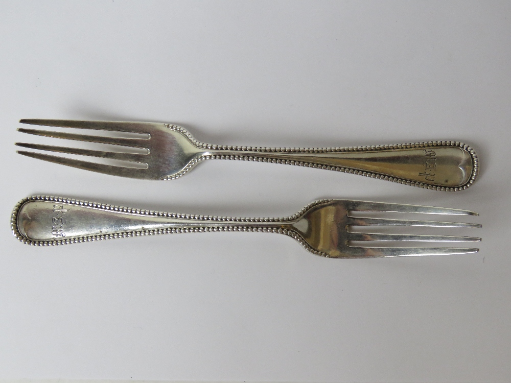 A pair of Victorian HM silver forks hallmarked for London and weighing 150.1g / 4.84ozt.