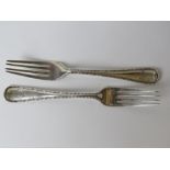 A pair of Victorian HM silver forks hallmarked for London and weighing 150.1g / 4.84ozt.