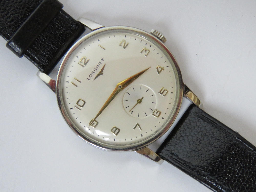 A vintage Longines manual wristwatch having subsidiary seconds dial and replacement strap.