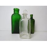 A green glass bottle marked 'Bottled by Jeyes' standing 15cm high.