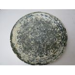 An 'Oriental ivory' plate having blue decoration on white ground, a/f, approx 23cm dia.