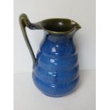 A Denby ware blue and green glazed jug standing 18.5cm high.