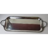 A large and impressive silver plated drinks tray having twin end handles, approx 68cm wide.