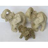 A carved soapstone figurine of an elephant having smaller carved elephant within.