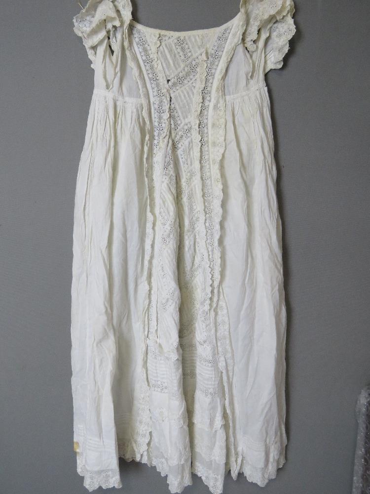 A white cotton and lace Christening robe.