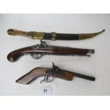 Two replica antique decorative pistols together with a souvenir dagger. Three items.