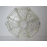 A milk glass hors d'ouvres tray having nine segments and measuring 34cm wide.