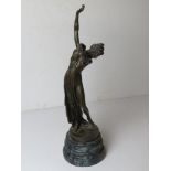 A contemporary bronzed brass figurine of a partially nude female on serpentine base,