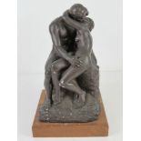 A bronzed plaster sculpture 'Rodin's the Kiss' 30cm high.