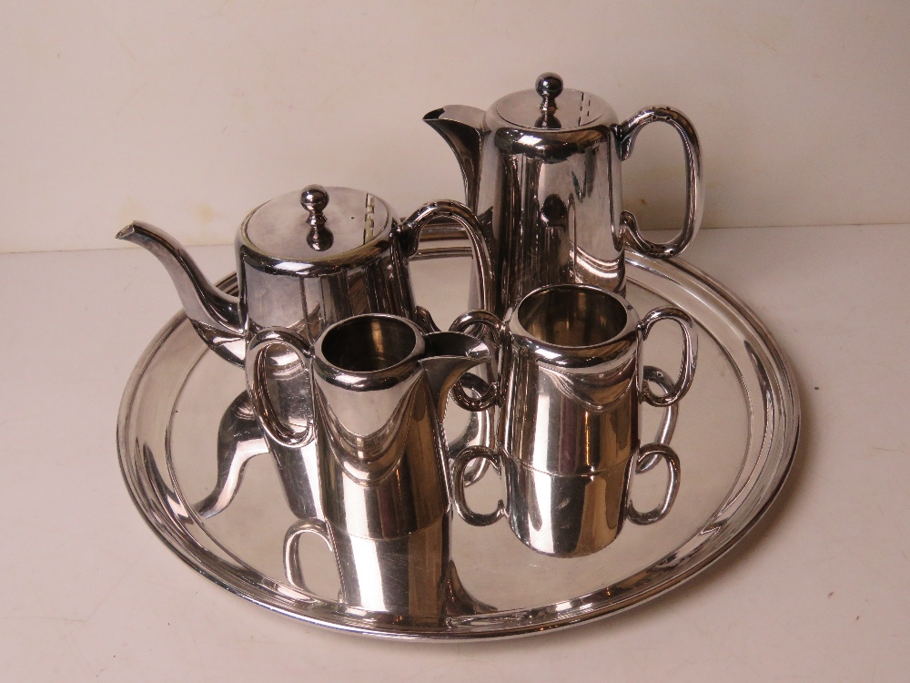 A Walker and Hall silver plated five piece tea service comprising tray, milk, sugar,