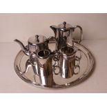 A Walker and Hall silver plated five piece tea service comprising tray, milk, sugar,