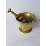 A brass pestle & mortar approx 12cm dia.