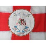 An antique English flag having hand woven tapestry to centre with initial 'M' and 1916 - 1919 India
