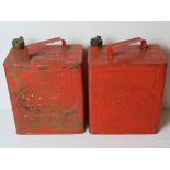 Of automotive interest; two red painted vintage Esso cans, one with brass cap,