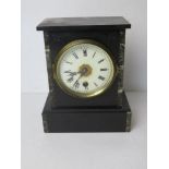 A Victorian black slate and marble architectural mantle clock manufactured by the Ansonia Clock