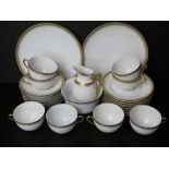 A Czechoslovakian tea service comprising six cups and saucers, two cake plates, six side plates,