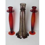 A single ruby and clear glass gilded candlestick having outswept column base.