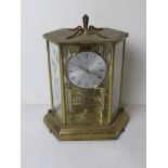 A brass and glass mantle clock by Kundo, approx 25cm high.