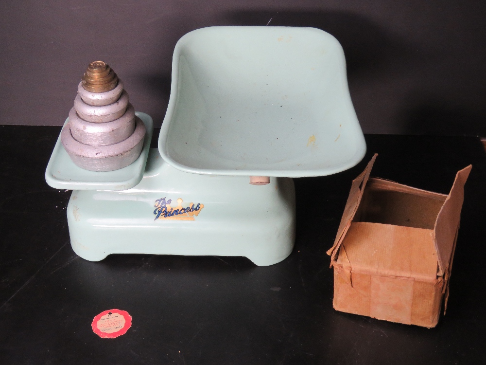 A green painted Weylux 'The Princess' set of weighing scales together with silver painted weights.