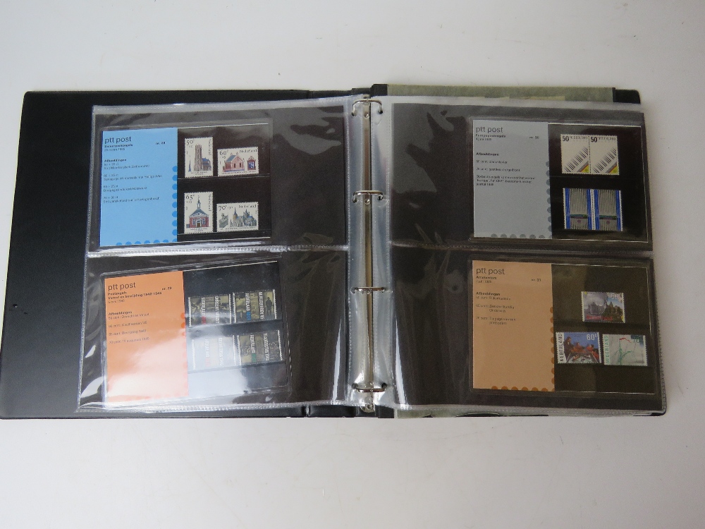 An album of stamp presentation packs for Netherlands.