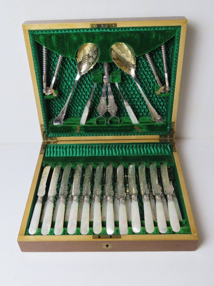 A fine cutlery set having including fish knives and forks with mother of pearl handles,