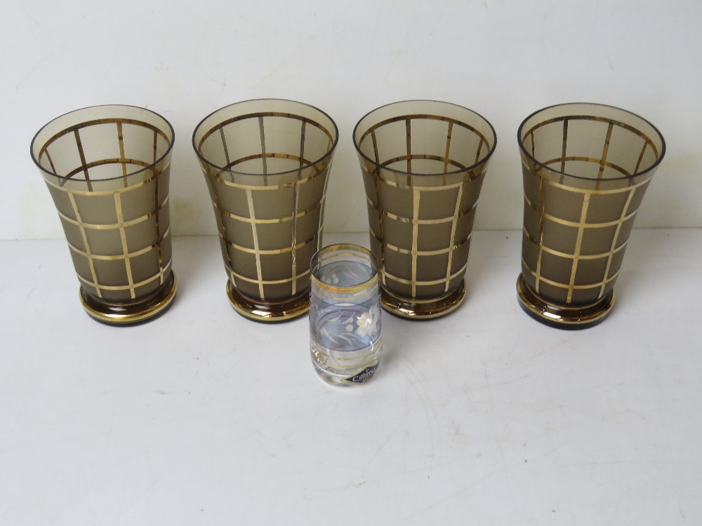 A set of four 1970s smoked glass and gil