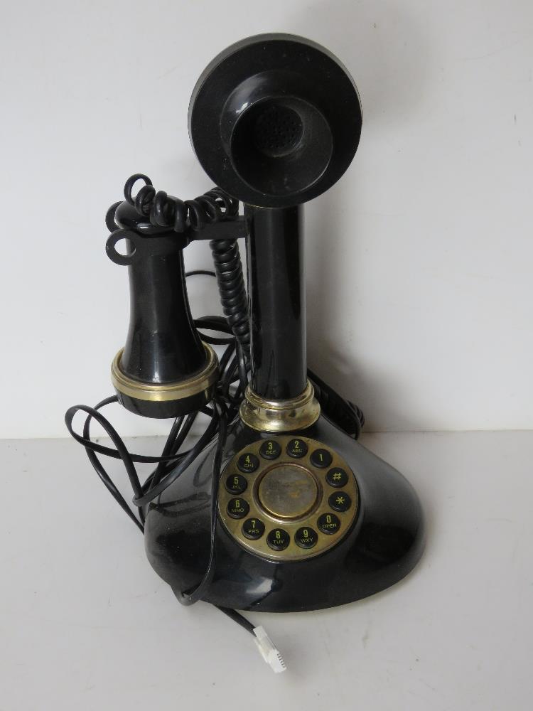 A contemporary black plastic telephone i