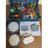 Two Wii Skylanders games together with a quantity of Skylanders figures, stands and Wii controller.