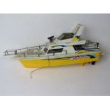 A Nikko Dolphin RC speedboat, controller deficient.