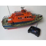 A RNLI Lifeboat RC Volunteer Spirit boat with controller.