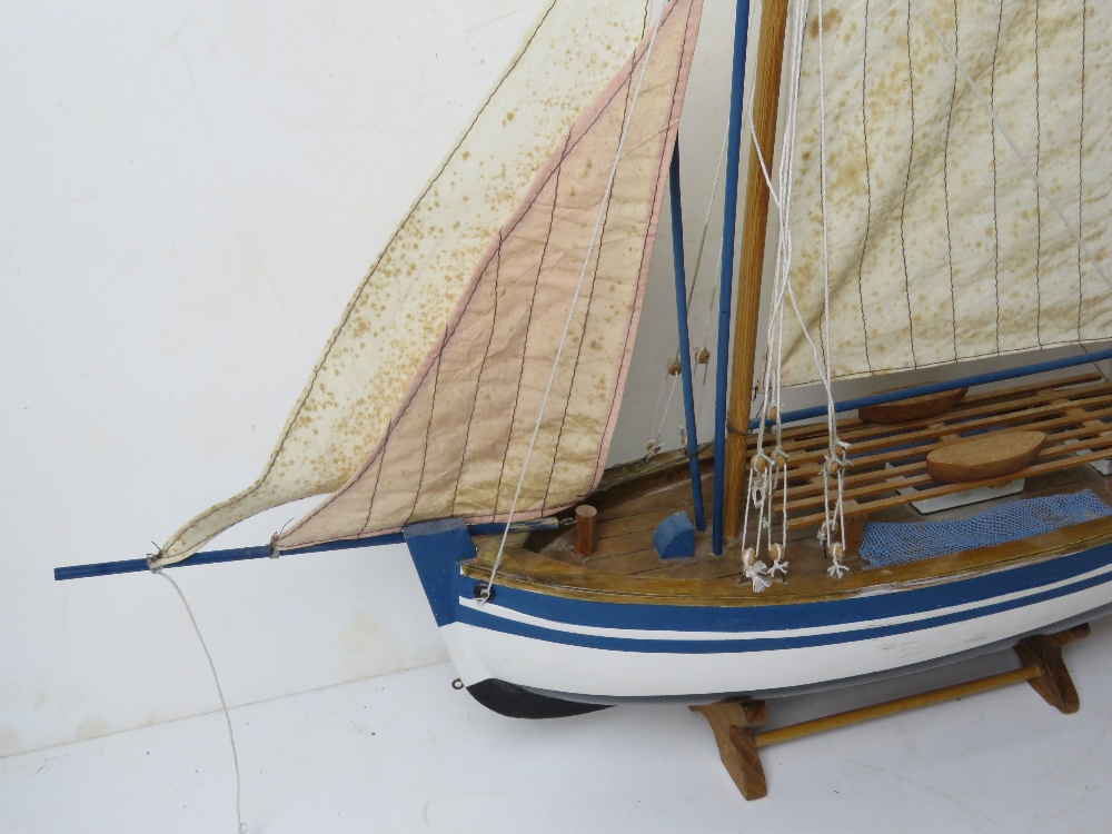 A model sailing boat having life boats and rigging measuring approx 70cm in length. - Image 3 of 5