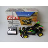 A Nikko Venus III radio controlled car in original box with controller. Untested.