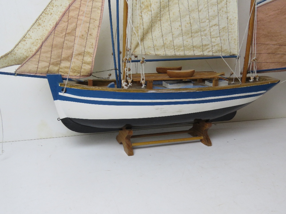 A model sailing boat having life boats and rigging measuring approx 70cm in length. - Image 5 of 5