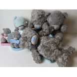 Five Me To You blue nose Teddy bears, together with a rucksack.