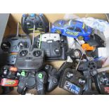 A RC Subaru Impreza together with a quantity of assorted RC vehicles and controllers.