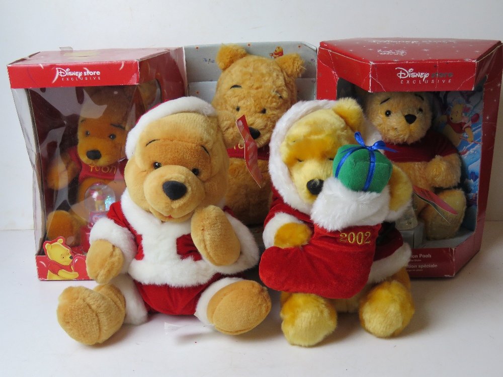Five assorted Winnie the Pooh Disney cuddly toys inc two snow globes.