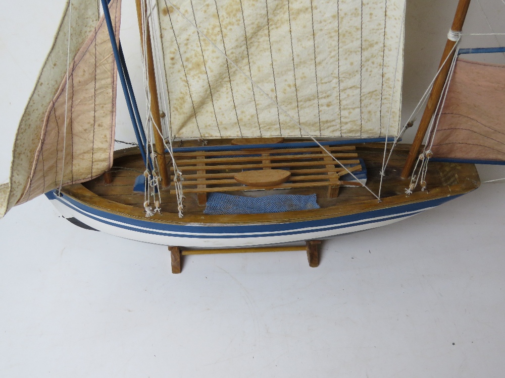 A model sailing boat having life boats and rigging measuring approx 70cm in length. - Image 2 of 5