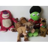 A Kermit the Frog cuddly toy, together with three Disney Toy Story and Scooby-Doo toy.