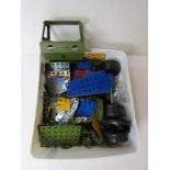 A small quantity of assorted Meccano inc wheels, Army green vehicle parts, etc.