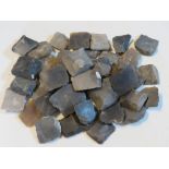 Approx forty antique brown bess flints.