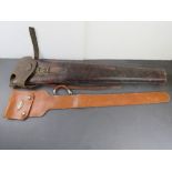 Two leather gun cases. One marked for He