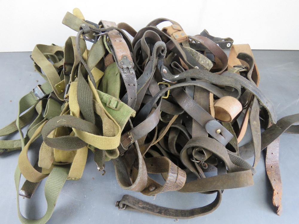 A quantity of leather and canvas slings.