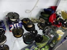A COLLECTION OF VARIOUS FISHING REELS AND SPOOLS.