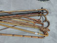 A QUANTITY OF VARIOUS VINTAGE WALKING STICKS.