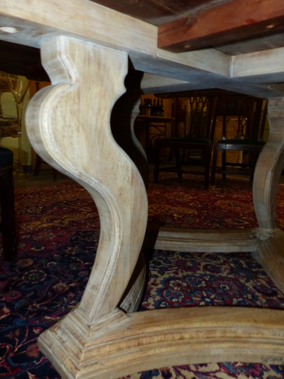 A BLEACHED OKA, "TUDOR ROSE" TABLE, THE SHAPED CIRCULAR TOP ON FOUR BRACKET LEGS JOINED BY A STRET - Image 4 of 5